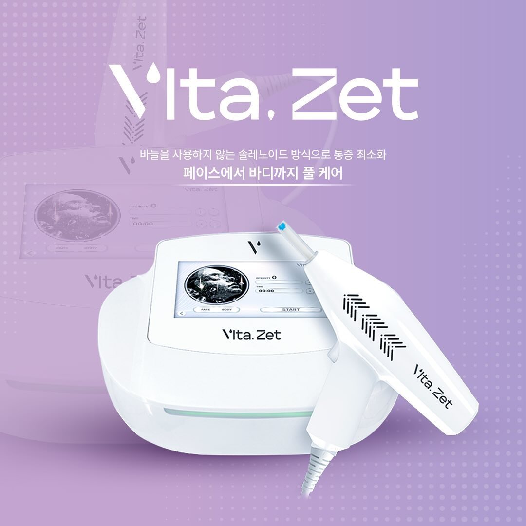 Máy Tiêm Meos Vita Zet màu trắng với tay cầm điều trị trên nền tím